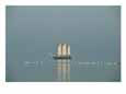 Three-masted schooner shown with swans in the early morning light