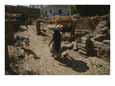A Woman Carries Fresh-Baked Bread Through a Stable Yard