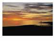 Sunset over a distant fisherman