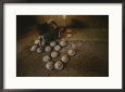An Egyptian Woman Makes Loaves of Bread in a Traditional Manner