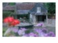 Boat Moored Next To Stone Cottage