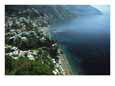 An aerial view of hillside villages on the water at Positano