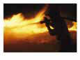 Fire-fighter battling a blaze at night