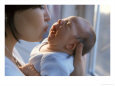 Mother Kissing Infant