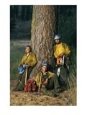 Portrait of three fire-fighters standing by a tree