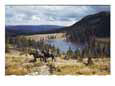 Two horsemen ride above Pecos Baldy Lake