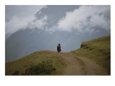 A Lone Peruvian Woman on a Dirt Road High in the Andes Scenic Streets & Roadways