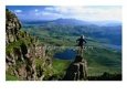 Walker Looking Towards Suilven from Stac Pollaigh, Scotland