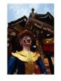 Buddhist Monastery Statue and Worker at Xishuangbanna, Yunnan, China