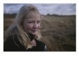 An informal portrait of a girl with the wind in her hair