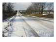 A Snow-Covered Road Passes Through Nebraska Farm Land Scenic Streets & Roadways
