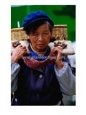 Portrait Of Woman From The Naxi Minority At Market, Lijiang, China
