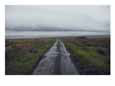 Wet Road Leading off to Nowhere with a Storm Coming in from the Atlantic Ocean