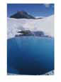 A deep blue pool of icy water on Root Glacier, below Donoho Peak