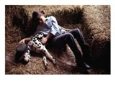 A Young Girl Sleeping in the Hay with Her Pet Dalmatian