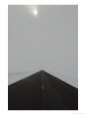 A Road Cleared of Snow Leads Toward the Horizon