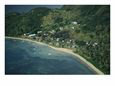 Aerial View of a Waterside Village with a Pristine Shoreline