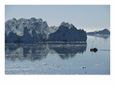 Fishing Boat Maneuvers Around Icebergs near the Ilulissat Glacier