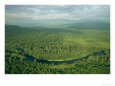 Aerial View of a River Snaking Through a Hilly Forested Landscape