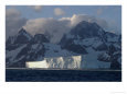A tabular iceberg juts from the icy Atlantic waters.