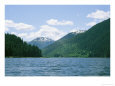 Snow-Dappled Mountains, Evergreen Trees, and a Calm Waters