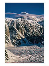 A Scenic View of Denali with Wispy Smoke-Like Clouds