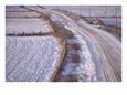 Country Road Covered in Snow