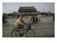 Cyclists Blur by Tiananmen Square