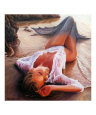 A mermaid in the sunset