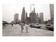 Two Ladies Walking the Sidewalk Skyscrapers in Chicago America