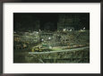 An Elevated View of Ground Zeros Devastation at Night; Crews, Their Vehicles, and Other Equipment
