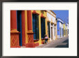 Woman Walking Past Colourful House Facades on Street, Campeche, Mexico