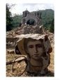 A Fresco Fragment with a Face of an Unidentified Saint Lays in the Grass Near the Ruins