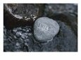Rock with the Word Smile in Rushing Water