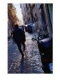 Man Walking Down Street of Trastevere Rome, Italy