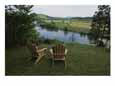 Two Adirondack Chairs on a Scenic Overlook