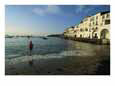 A Beach Goer Wades into the Calm Surf of Cadaques