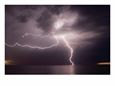 Dramatic Lightning Flashes Over Water