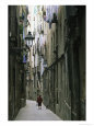 A Woman Walking Along the Narrow Streets of Bracelona, Spain