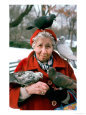 Birds Perched on Mature Woman Sitting in Park