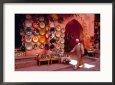 Muslim Man Walks by Wall of Moroccan Pottery, Marrakech, Morocco