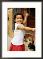 Young Girl with Puppy at Sunday Market, Mataderos, Buenos Aires, Argentina
