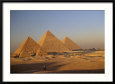 A Man on a Donkey in the Desert Near the Great Pyramids of Giza