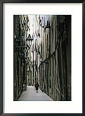 A Woman Walking Along the Narrow Streets of Bracelona, Spain