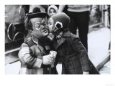 A Girl Delicately Kissing a Dwarf Dressed as a Clown on the Cheek