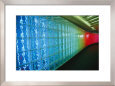 A Wall of Glass Bricks Distorts Colorful Neon into a Tinted Rainbow